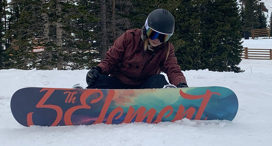 Snowboard sitting on bench