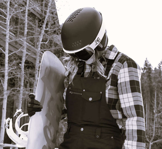 Woman holding a snowboard